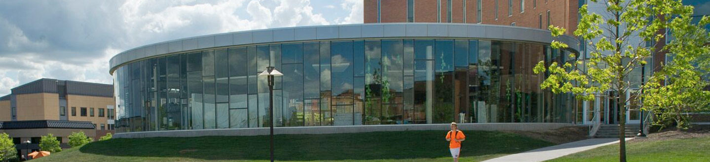student walking in front of the Innovation center