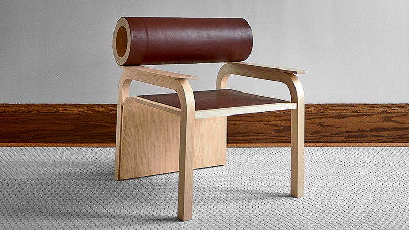 A chair design with a cylinder-shaped back support. 
